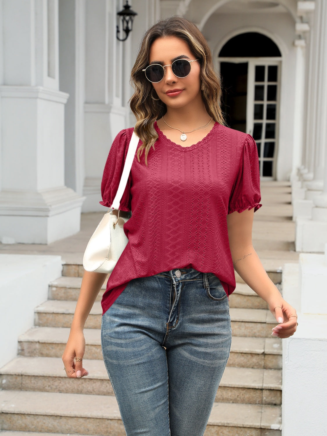 Eyelet round neck short sleeve blouse with frill.