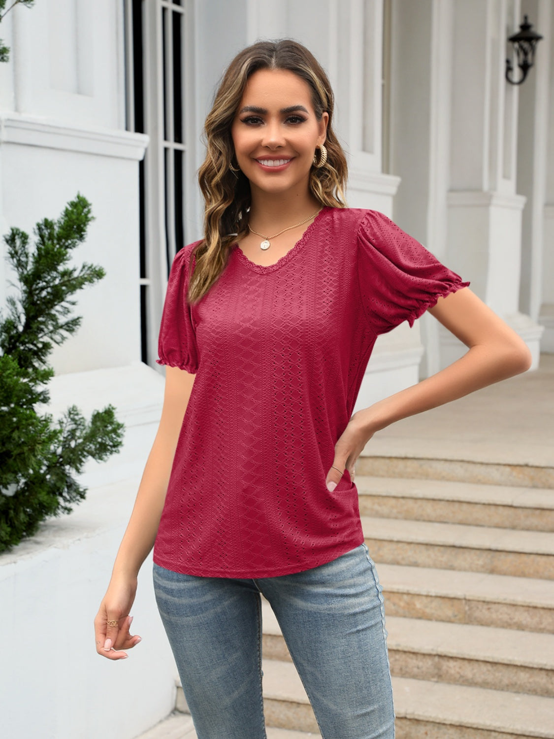 Eyelet round neck short sleeve blouse with frill.