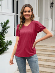 Eyelet round neck short sleeve blouse with frill.