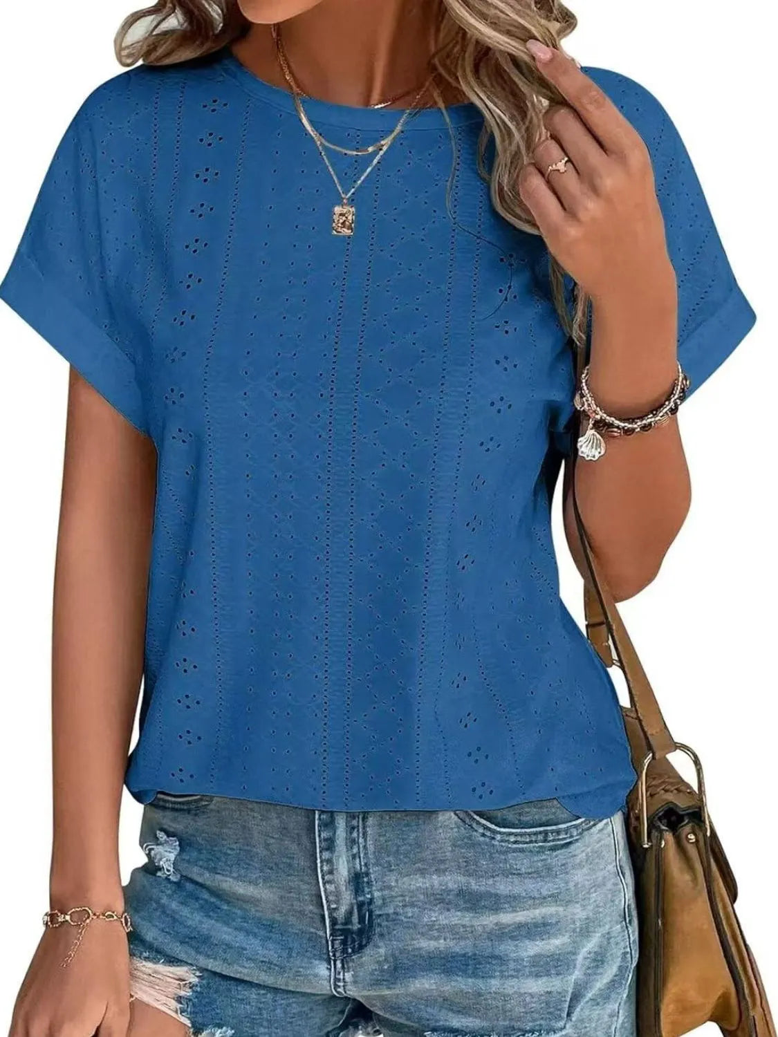 Eyelet round neck short sleeve top.