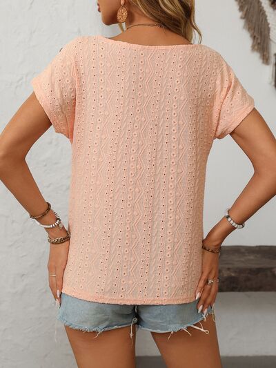 Mandy eyelet round neck short sleeve top with decorative buttons.