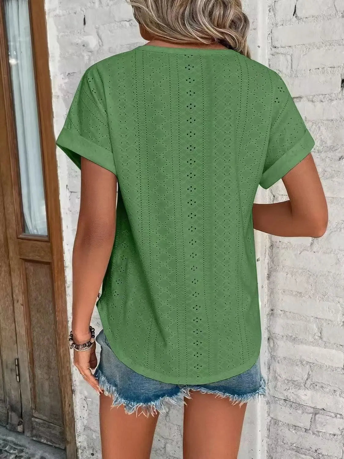Eyelet round neck short sleeve top.