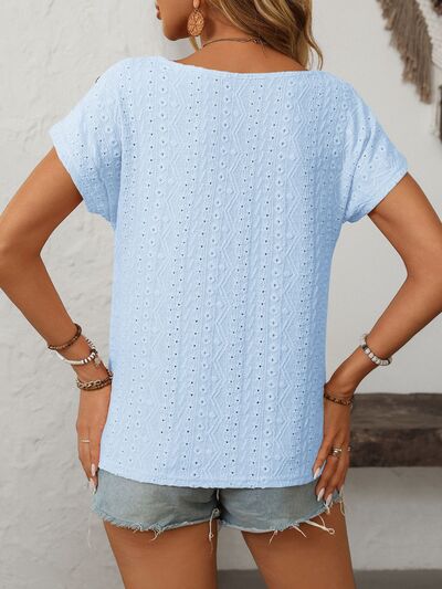 Mandy eyelet round neck short sleeve top with decorative buttons.