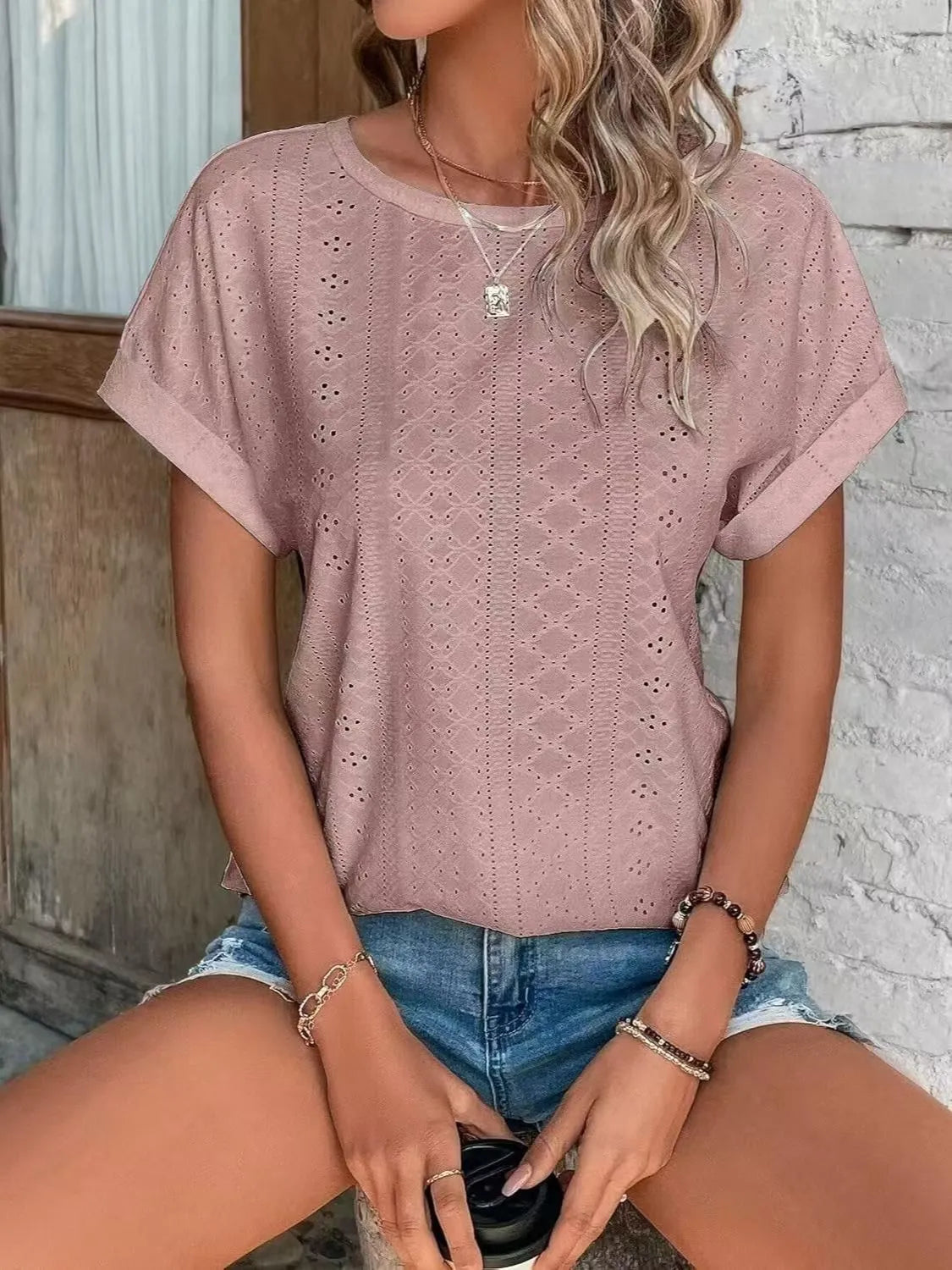 Eyelet round neck short sleeve top.