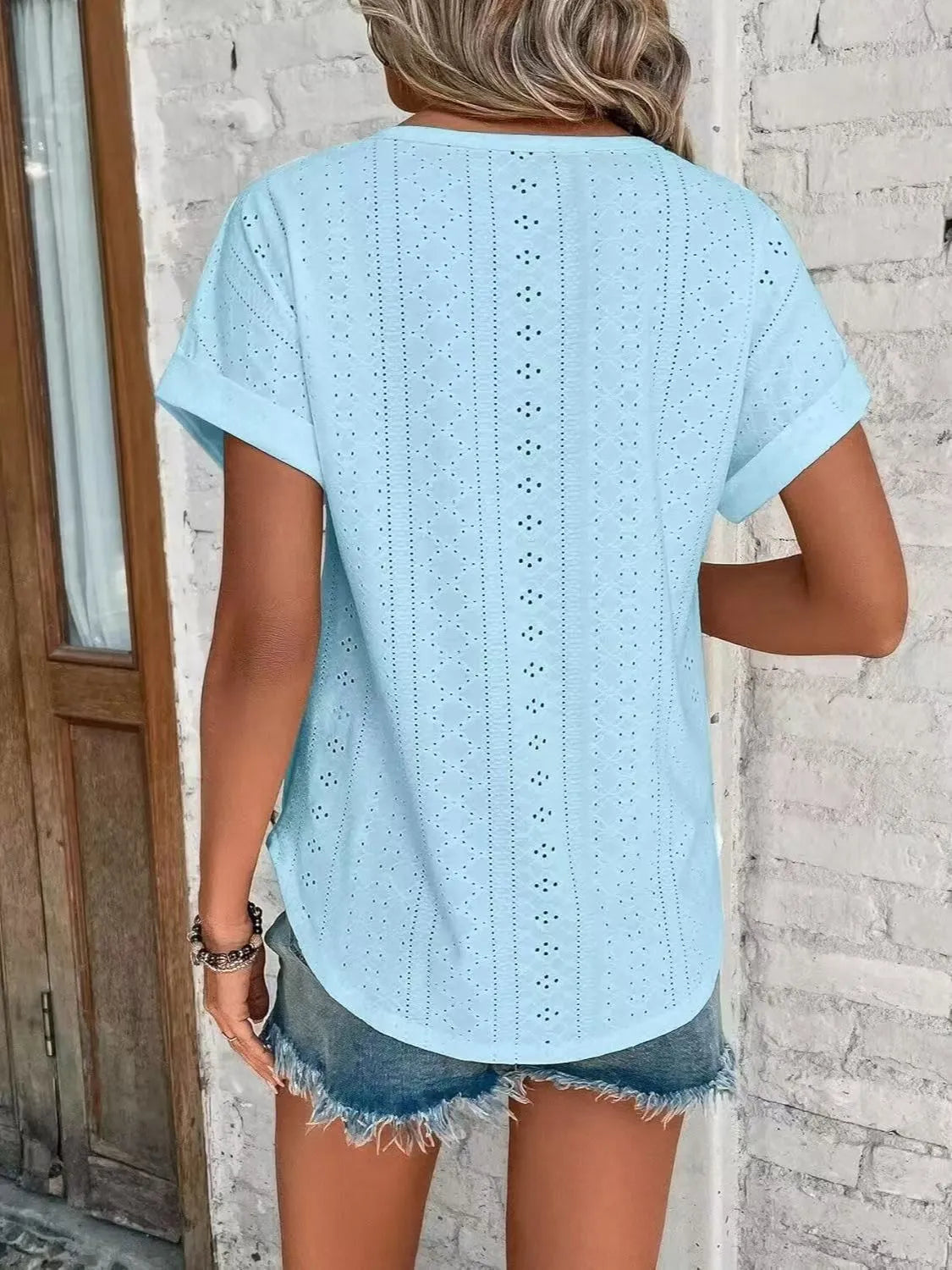 Eyelet round neck short sleeve top.