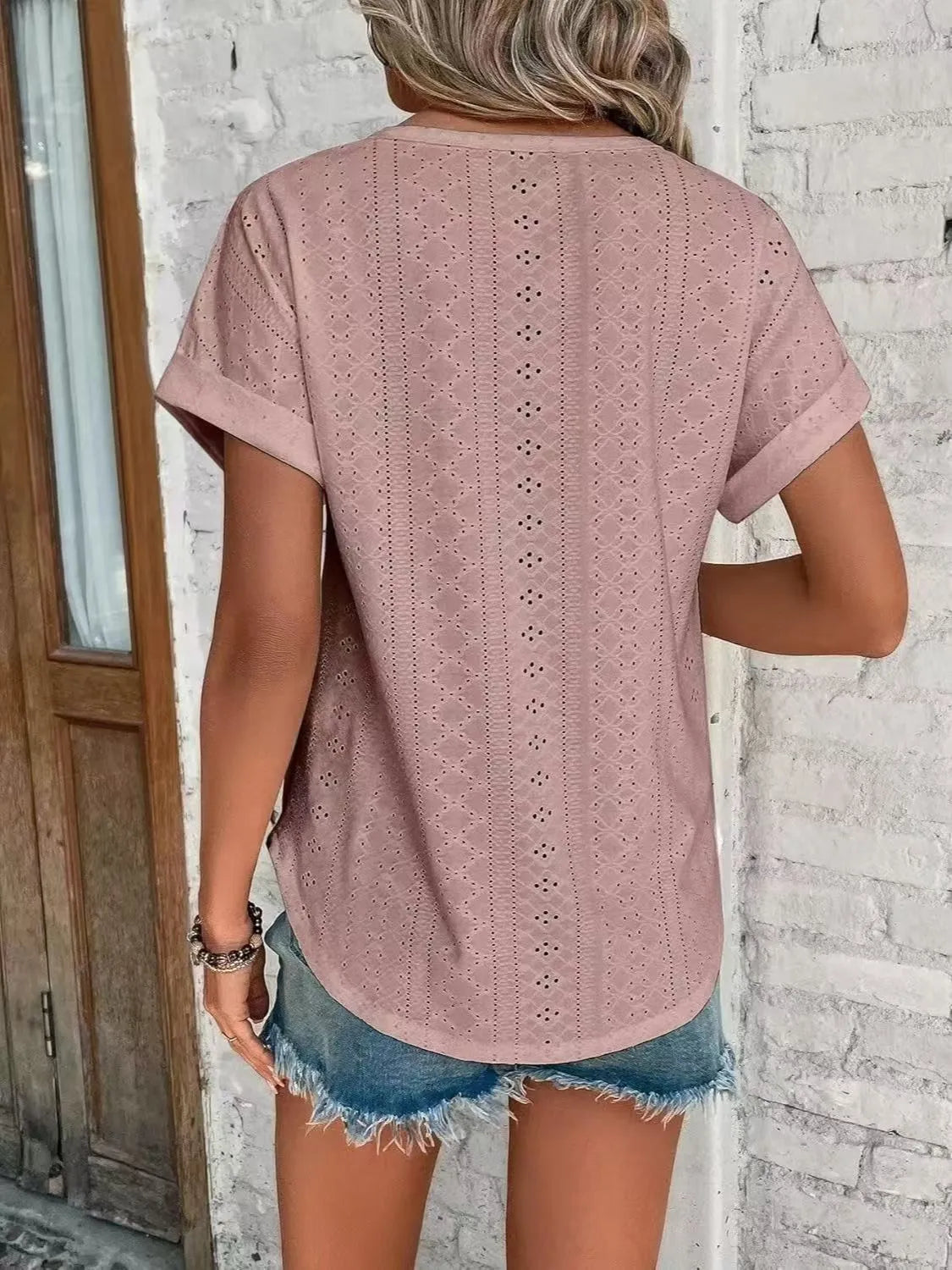 Eyelet round neck short sleeve top.