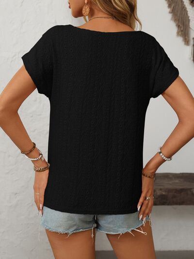 Mandy eyelet round neck short sleeve top with decorative buttons.