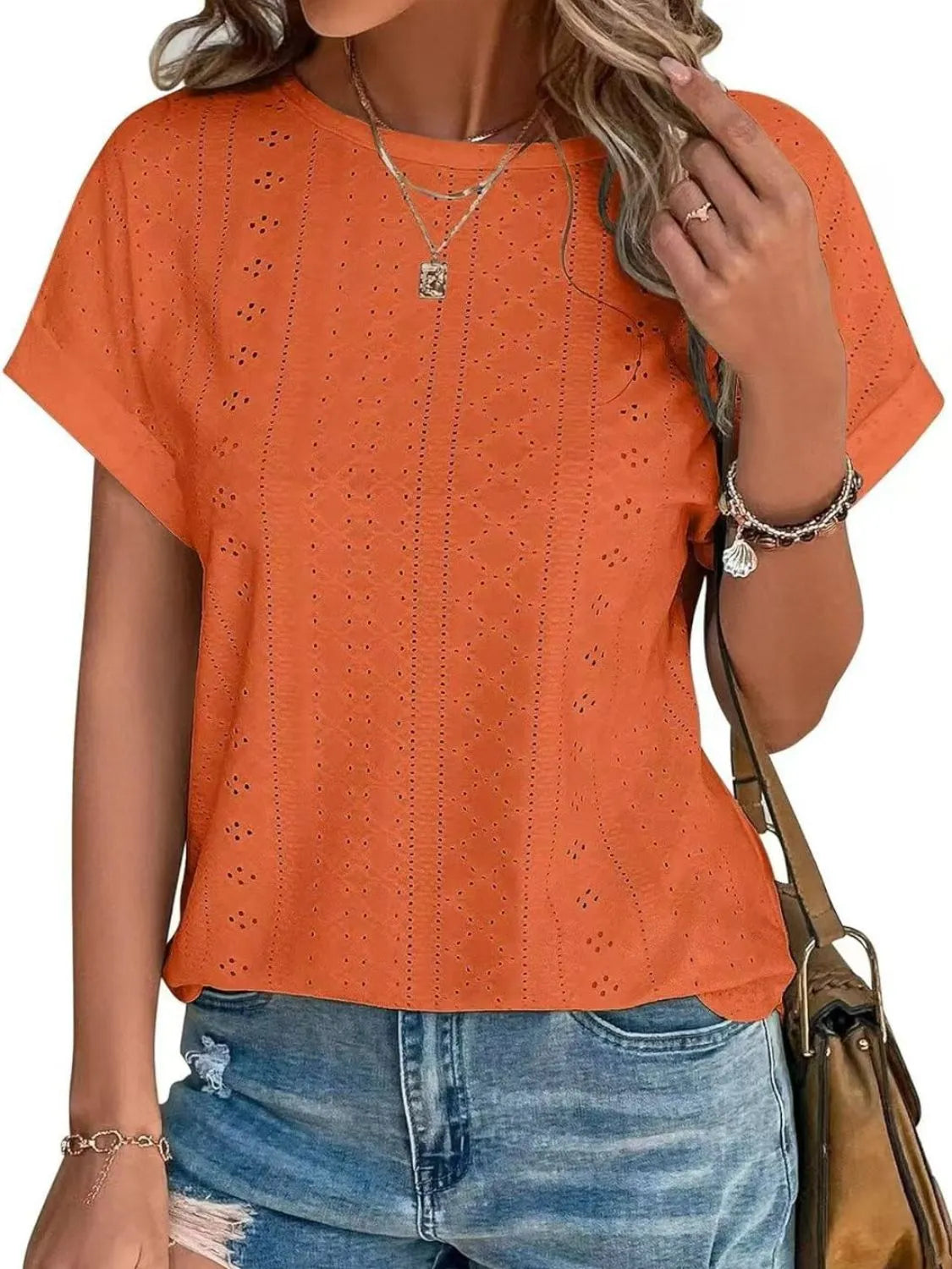 Eyelet round neck short sleeve top.