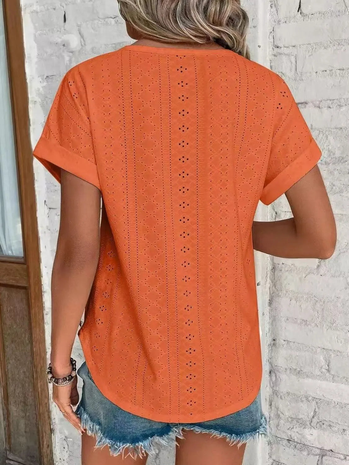 Eyelet round neck short sleeve top.