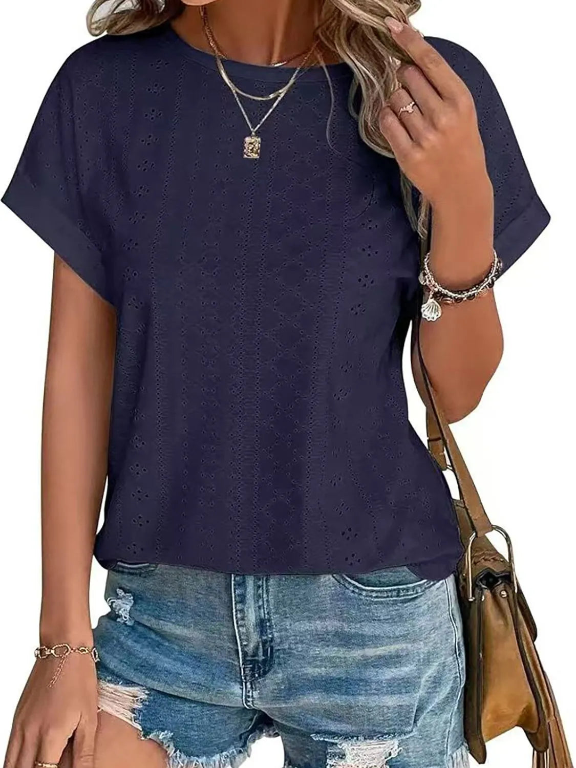 Eyelet round neck short sleeve top.