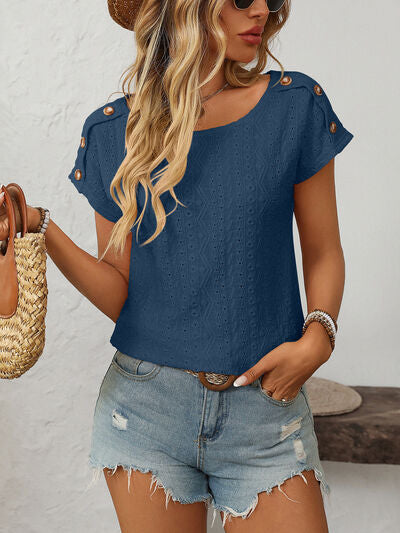 Mandy eyelet round neck short sleeve top with decorative buttons.