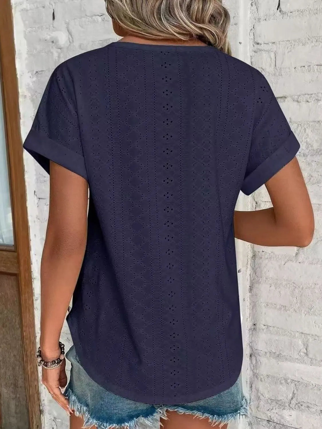 Eyelet round neck short sleeve top.