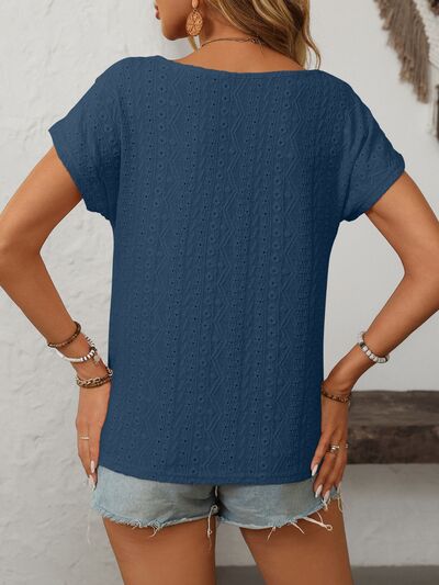 Mandy eyelet round neck short sleeve top with decorative buttons.