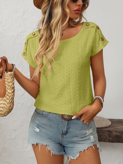 Mandy eyelet round neck short sleeve top with decorative buttons.