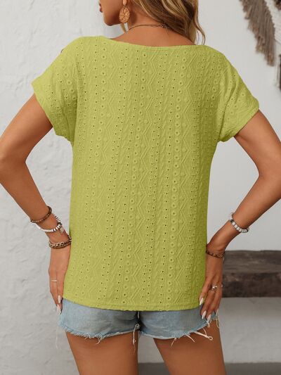 Mandy eyelet round neck short sleeve top with decorative buttons.
