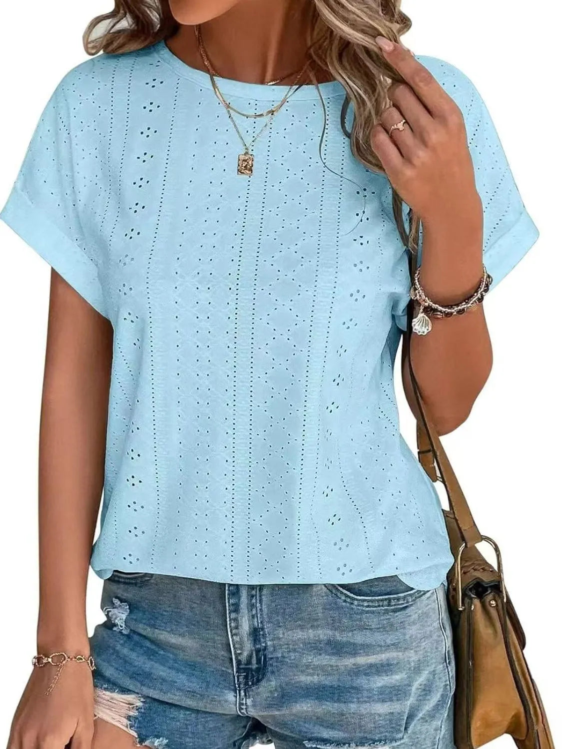 Eyelet round neck short sleeve top.