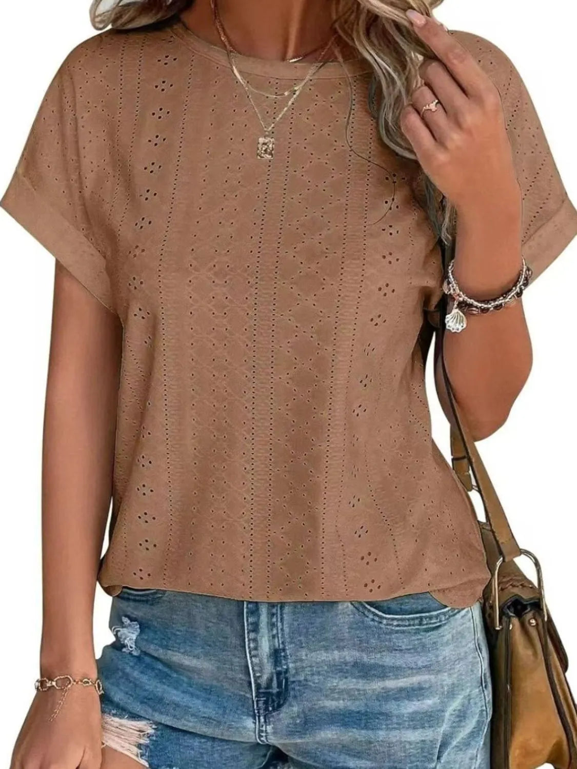 Eyelet round neck short sleeve top.