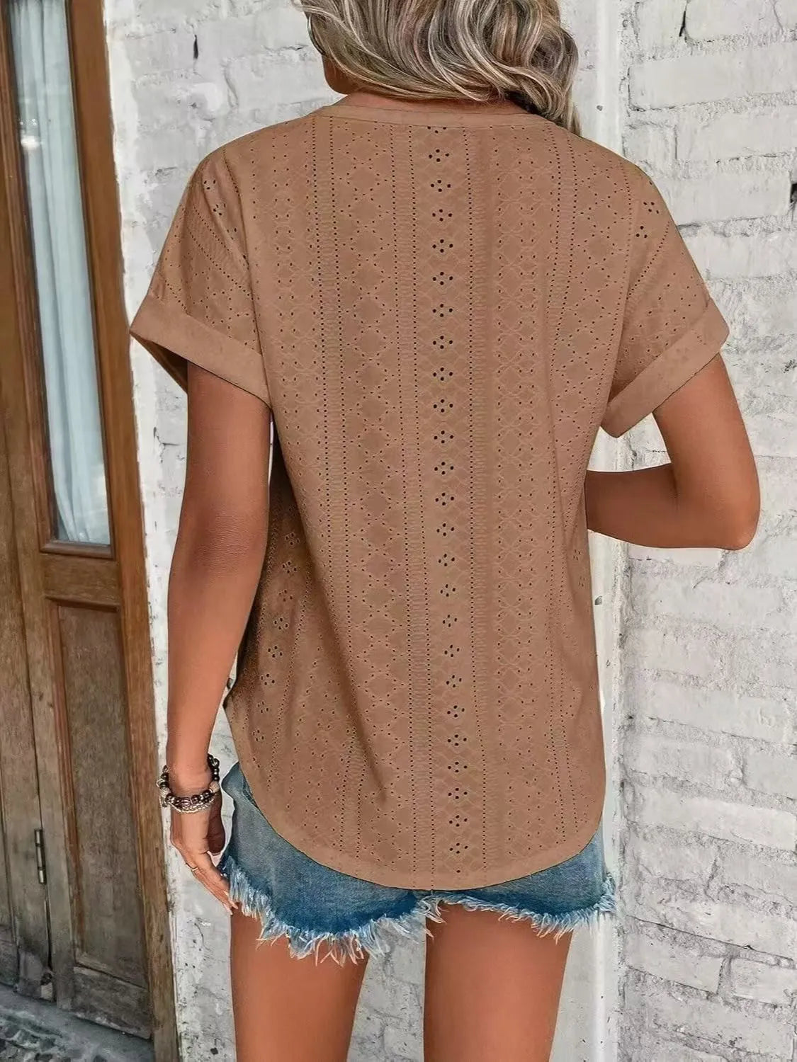 Eyelet round neck short sleeve top.