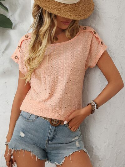 Mandy eyelet round neck short sleeve top with decorative buttons.