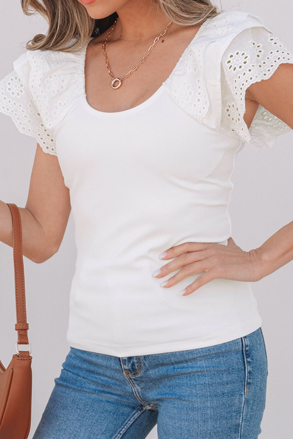 Eyelet ruffle sleeve slim top.