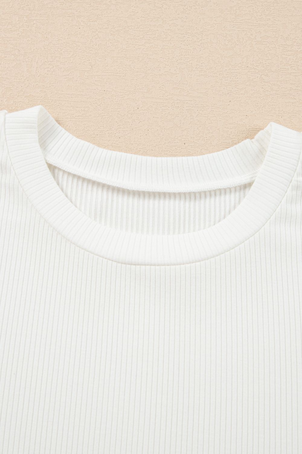 Eyelet short sleeve patchwork ribbed top.