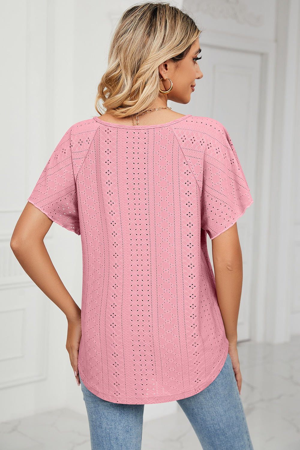 Eyelet tie neck flutter sleeve blouse.