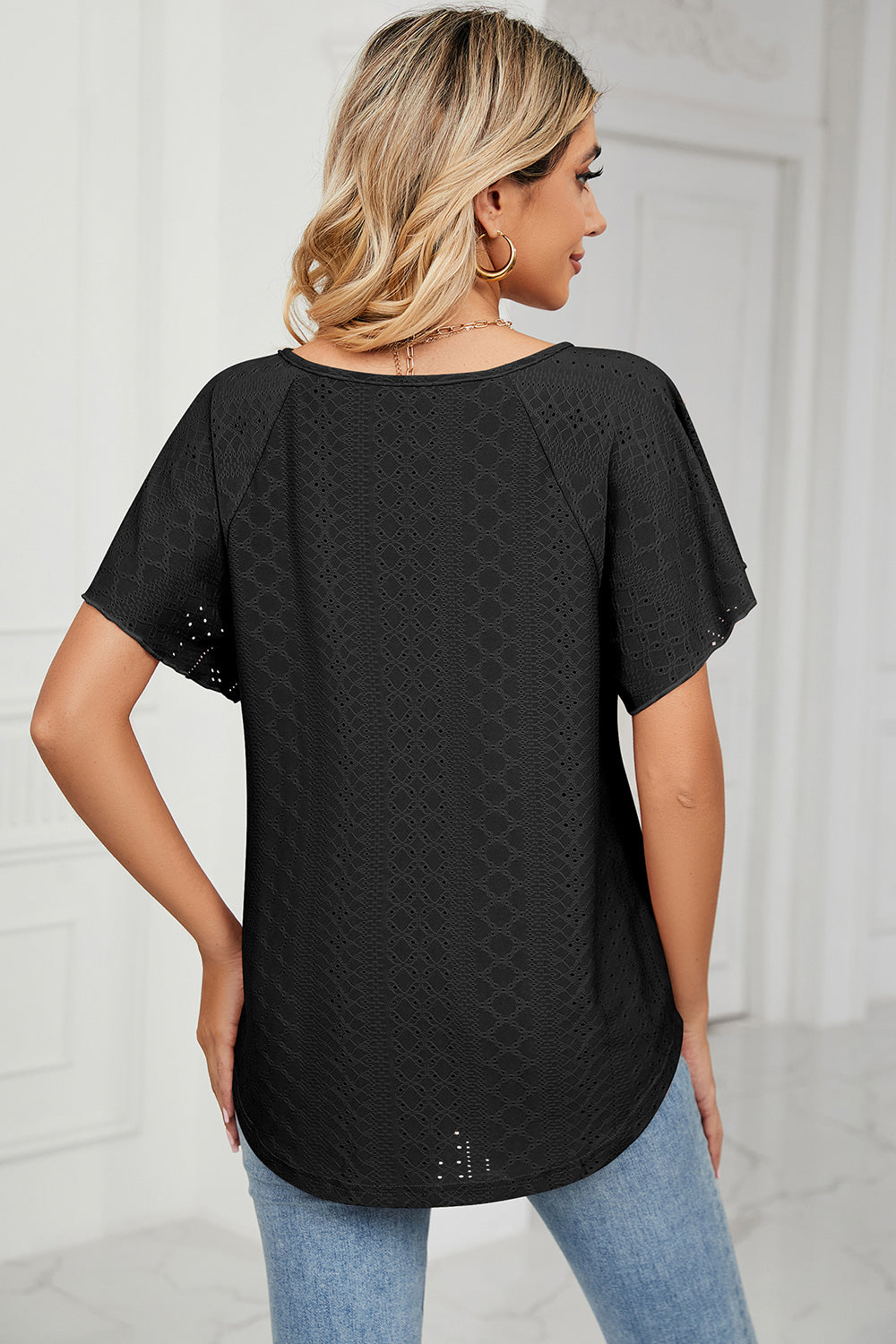 Eyelet tie neck flutter sleeve blouse.