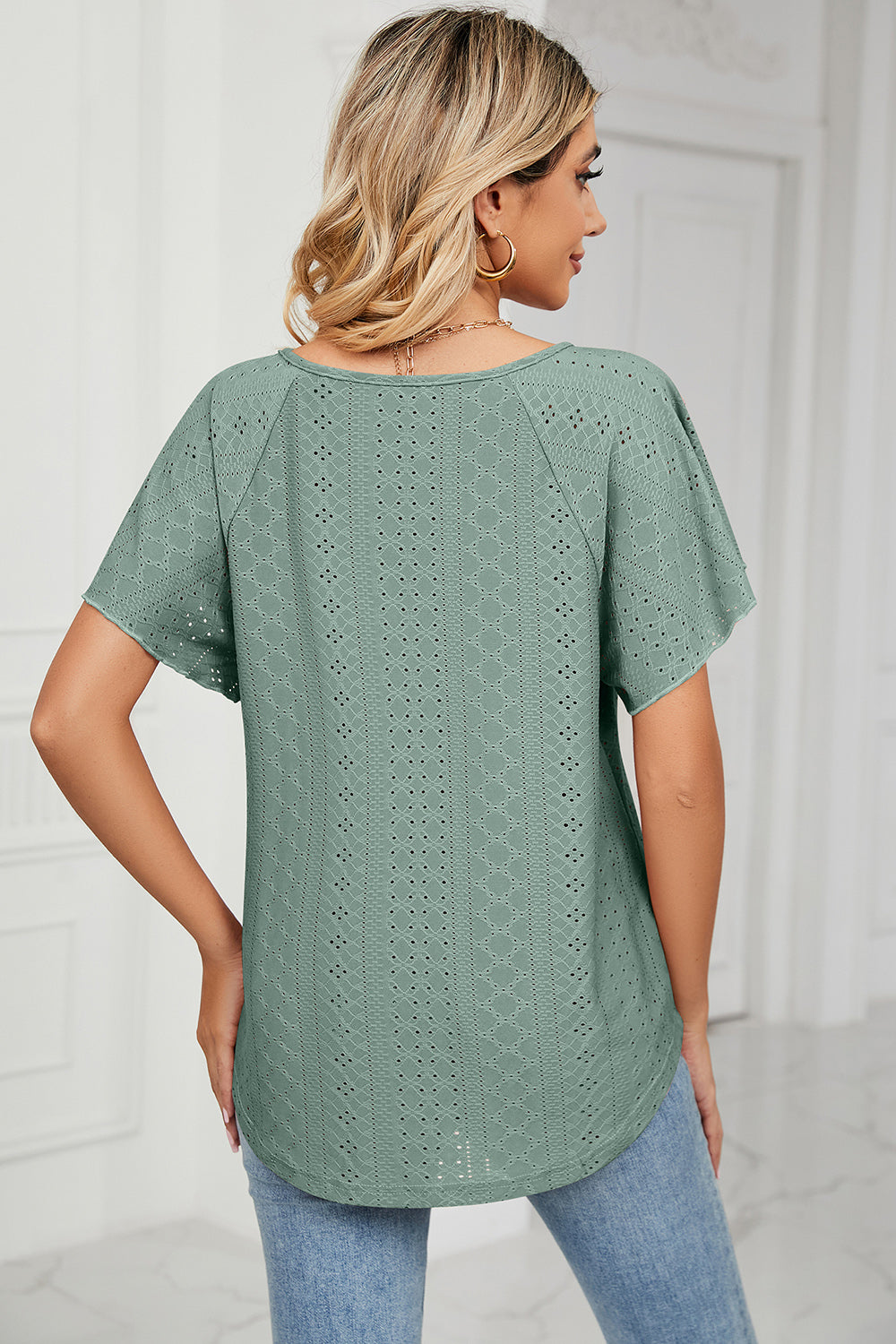 Eyelet tie neck flutter sleeve blouse.