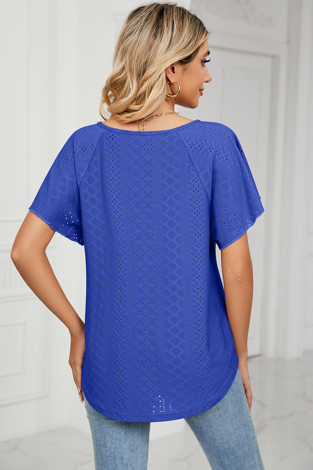 Eyelet tie neck flutter sleeve blouse.