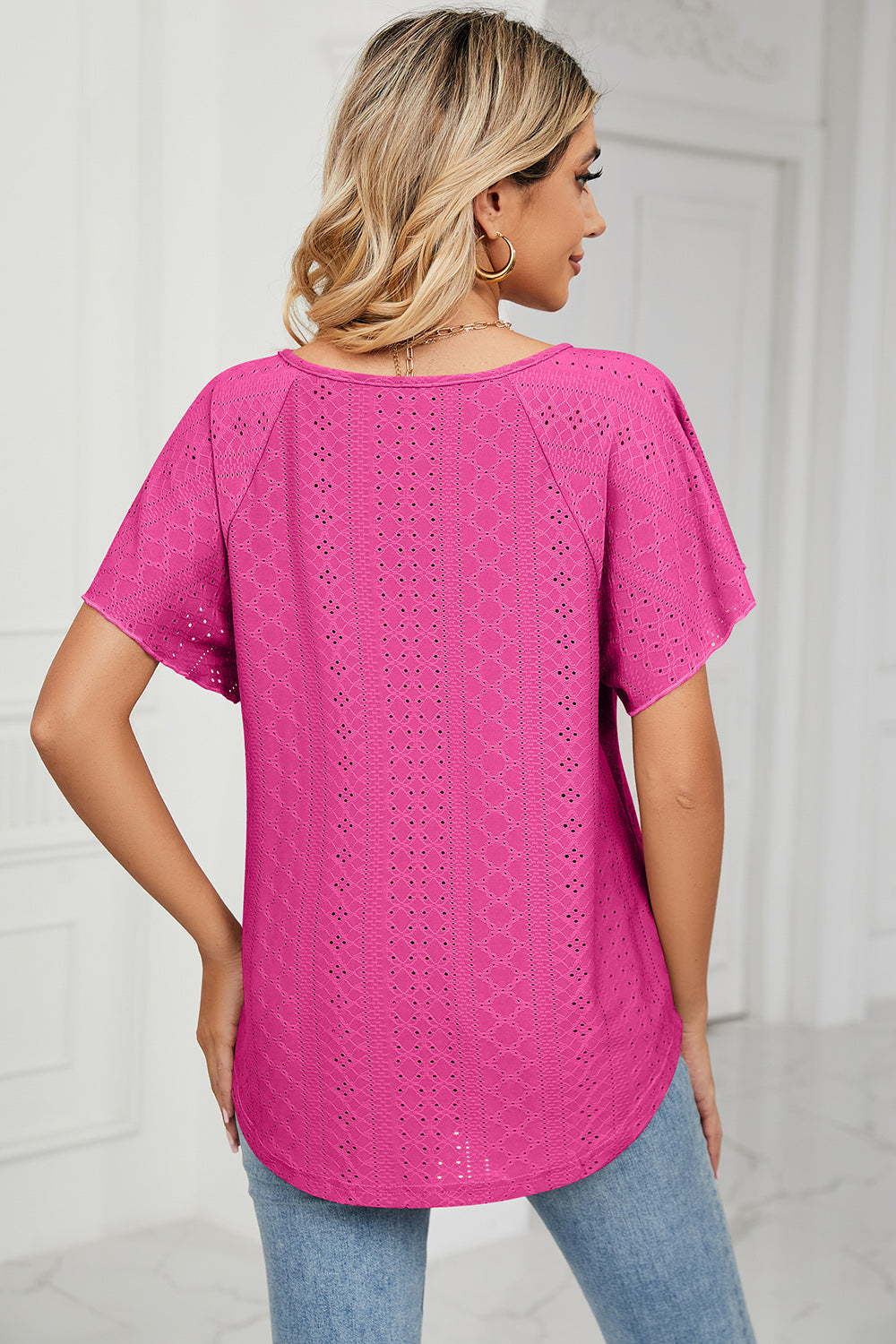 Eyelet tie neck flutter sleeve blouse.