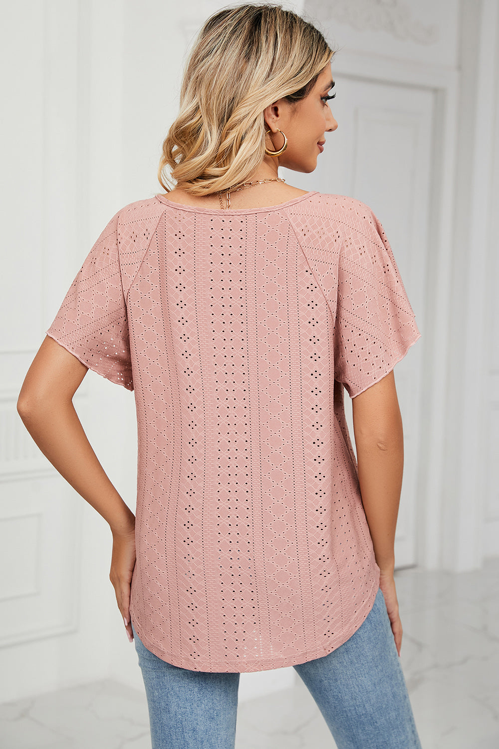 Eyelet tie neck flutter sleeve blouse.