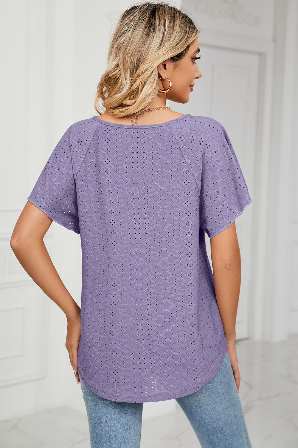 Eyelet tie neck flutter sleeve blouse.