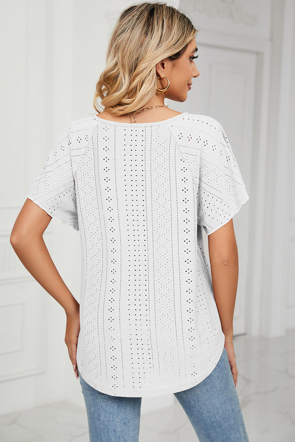 Eyelet tie neck flutter sleeve blouse.
