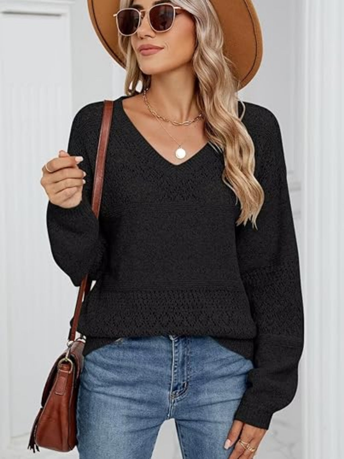 Eyelet V-neck long sleeve sweater.