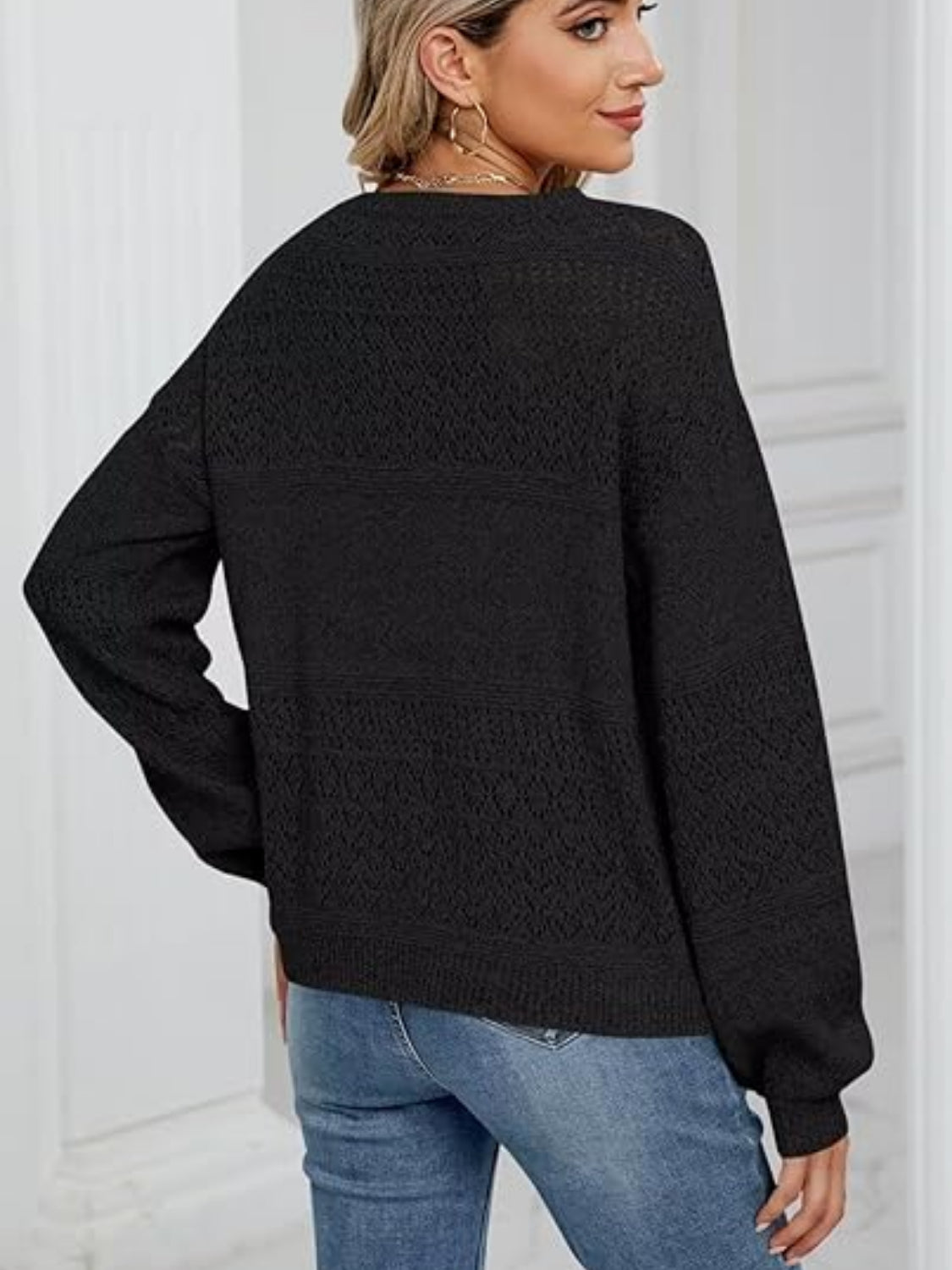 Eyelet V-neck long sleeve sweater.