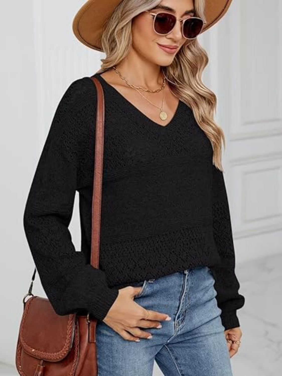 Eyelet V-neck long sleeve sweater.
