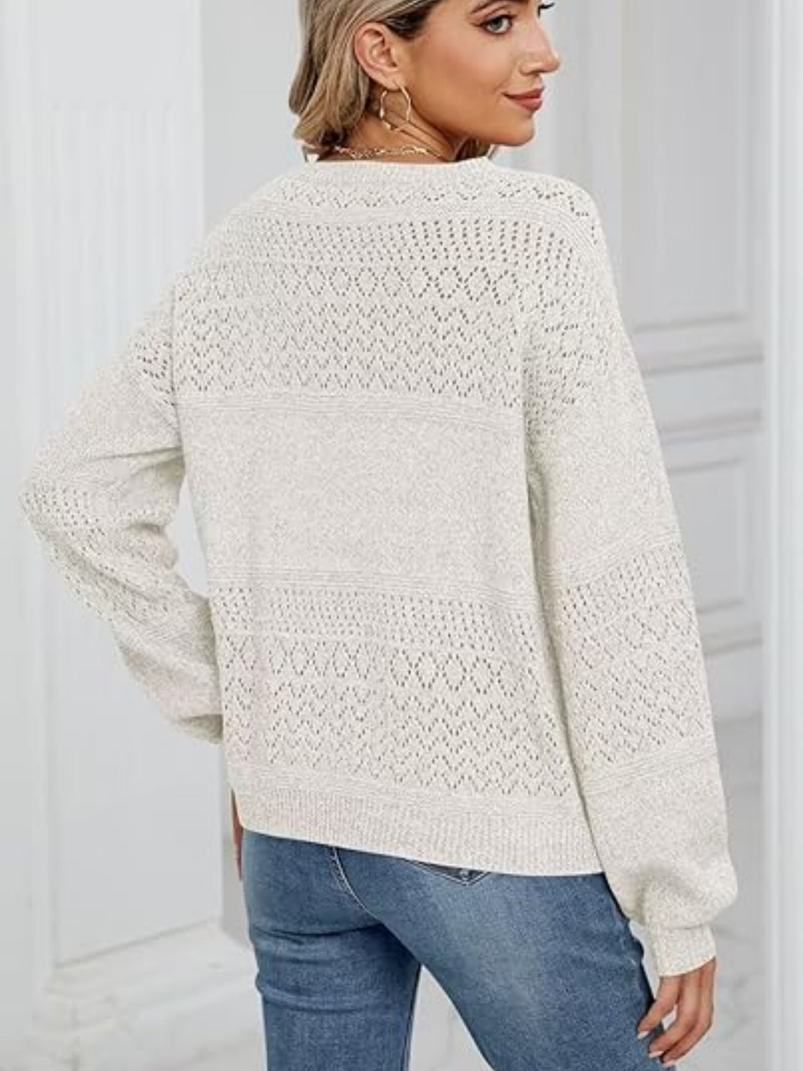 Eyelet V-neck long sleeve sweater.