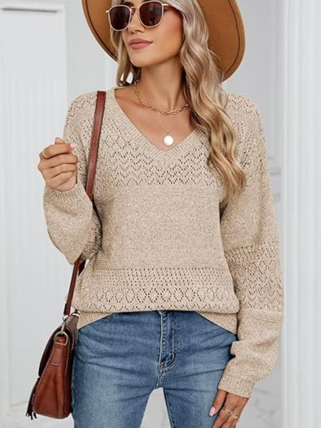 Eyelet V-neck long sleeve sweater.
