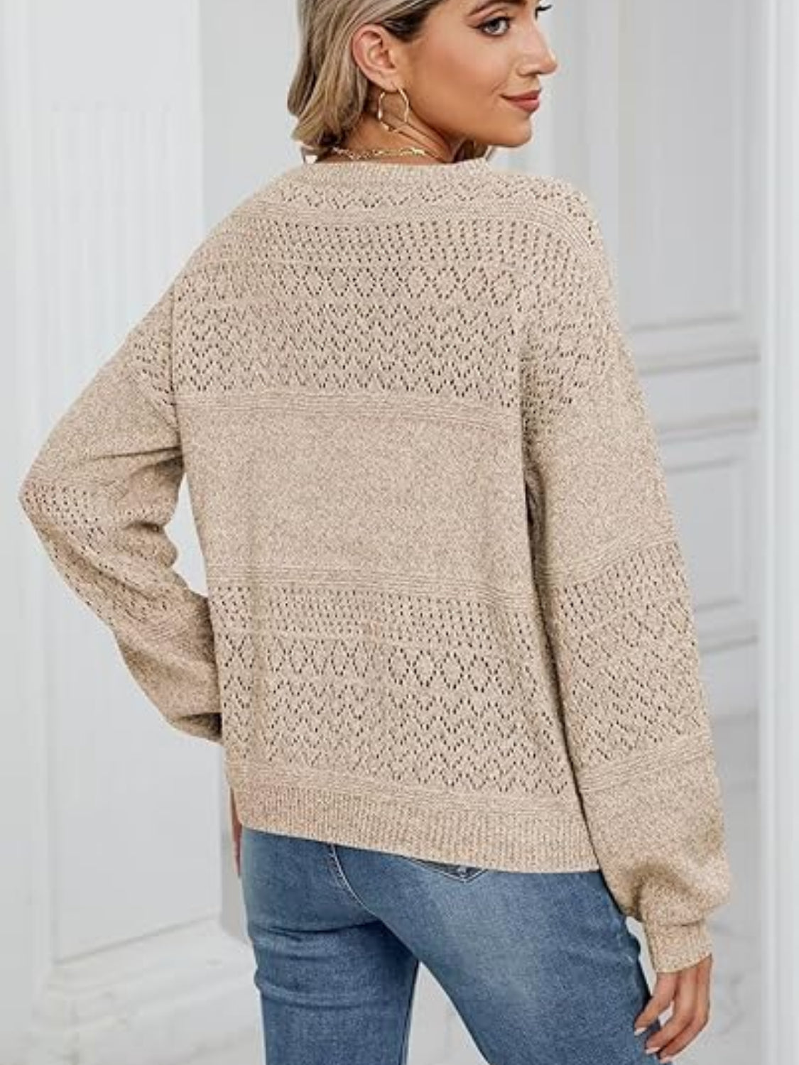 Eyelet V-neck long sleeve sweater.