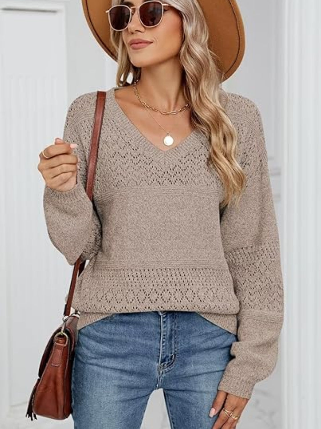 Eyelet V-neck long sleeve sweater.