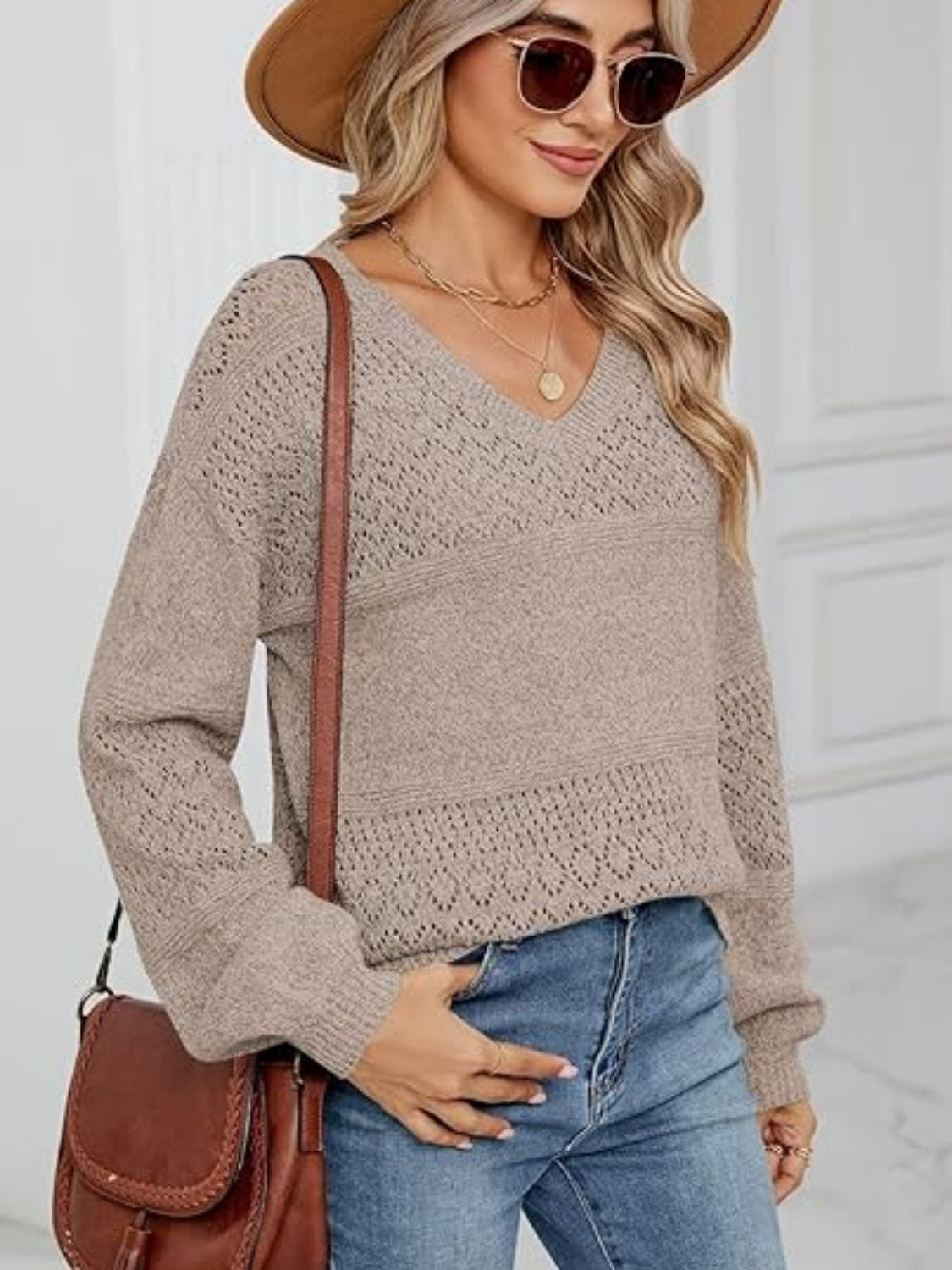 Eyelet V-neck long sleeve sweater.