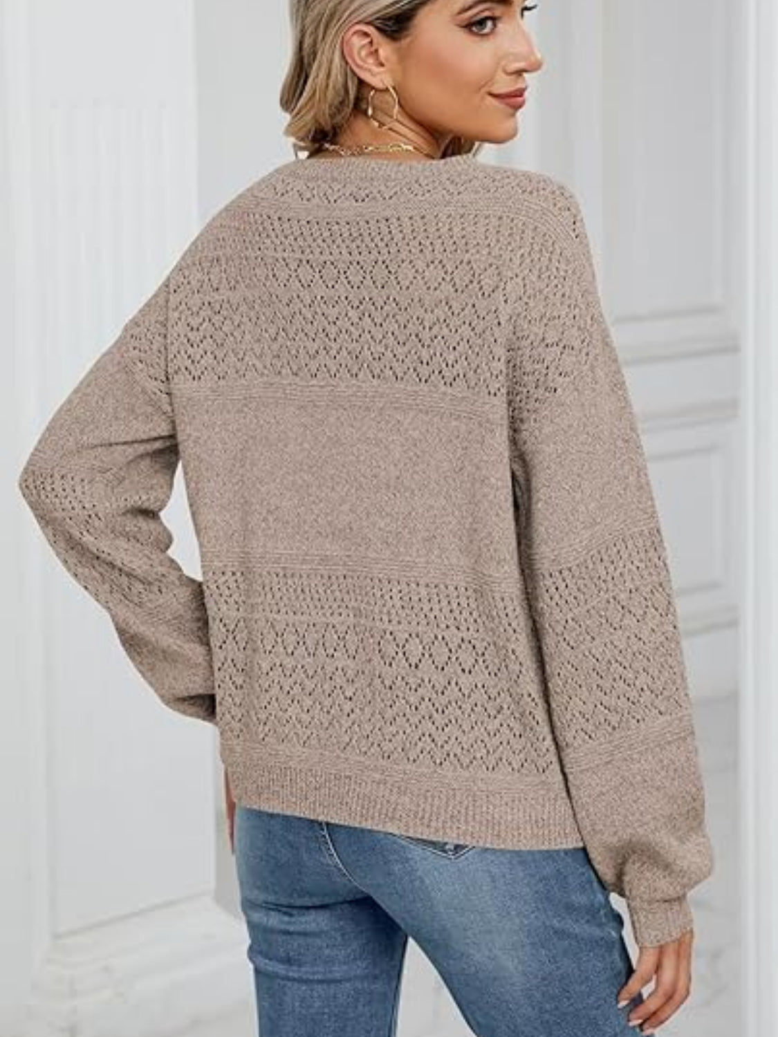 Eyelet V-neck long sleeve sweater.