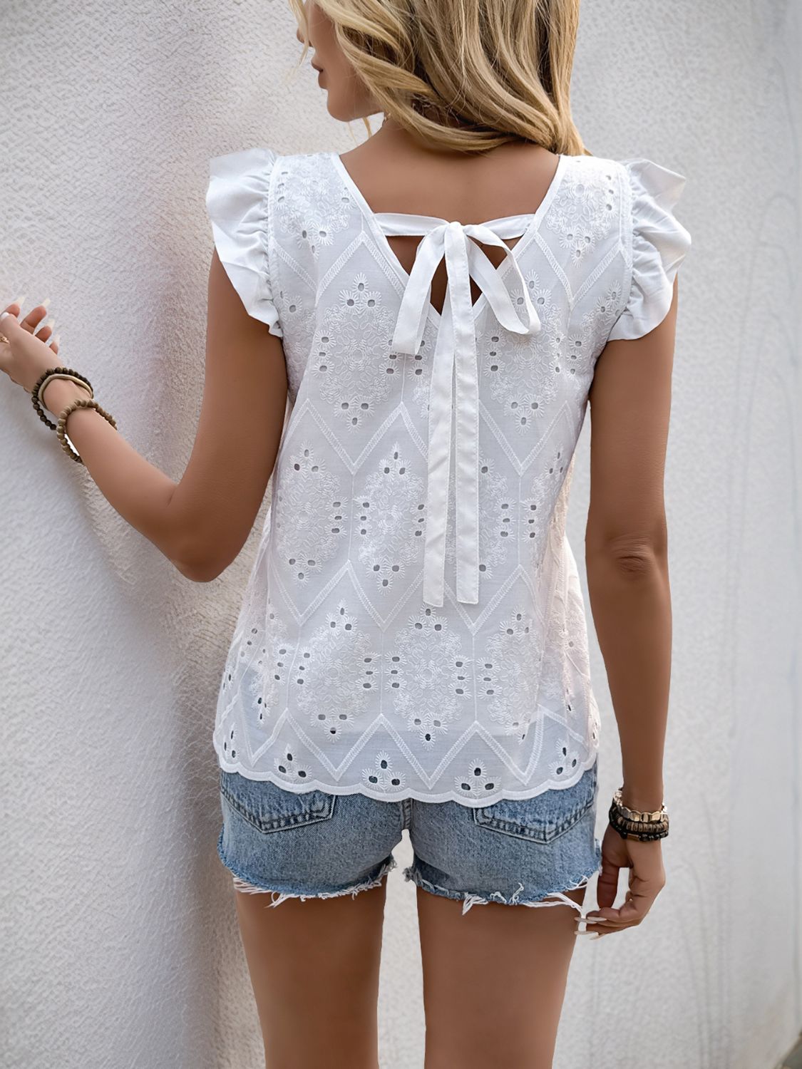 Perfee eyelet V-neck ruffled cap sleeve blouse.