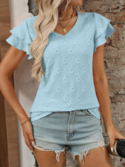 Eyelet V-neck ruffled cap sleeve top with decorative buttons and lace.