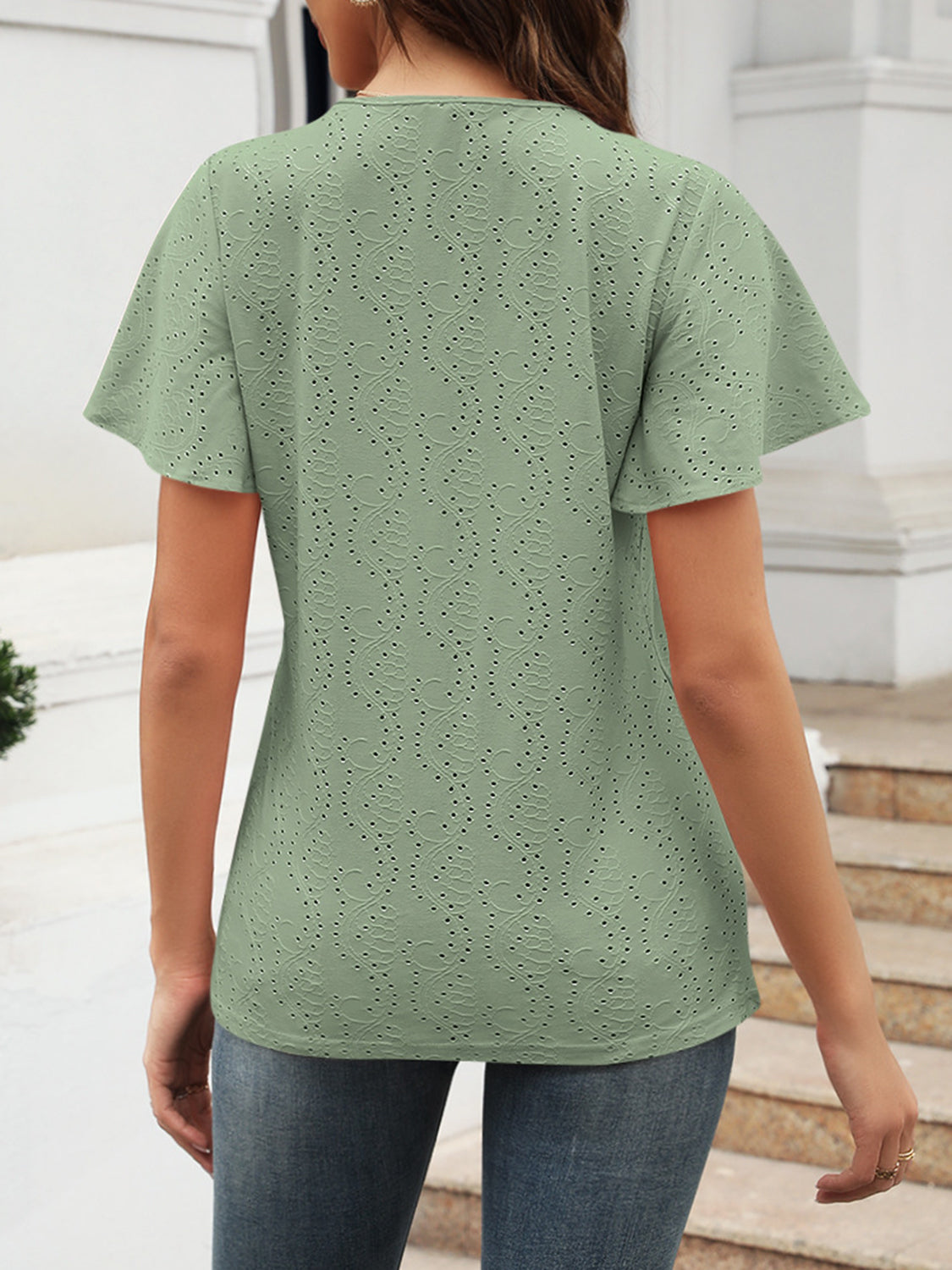 Eyelet V-neck short sleeve blouse.