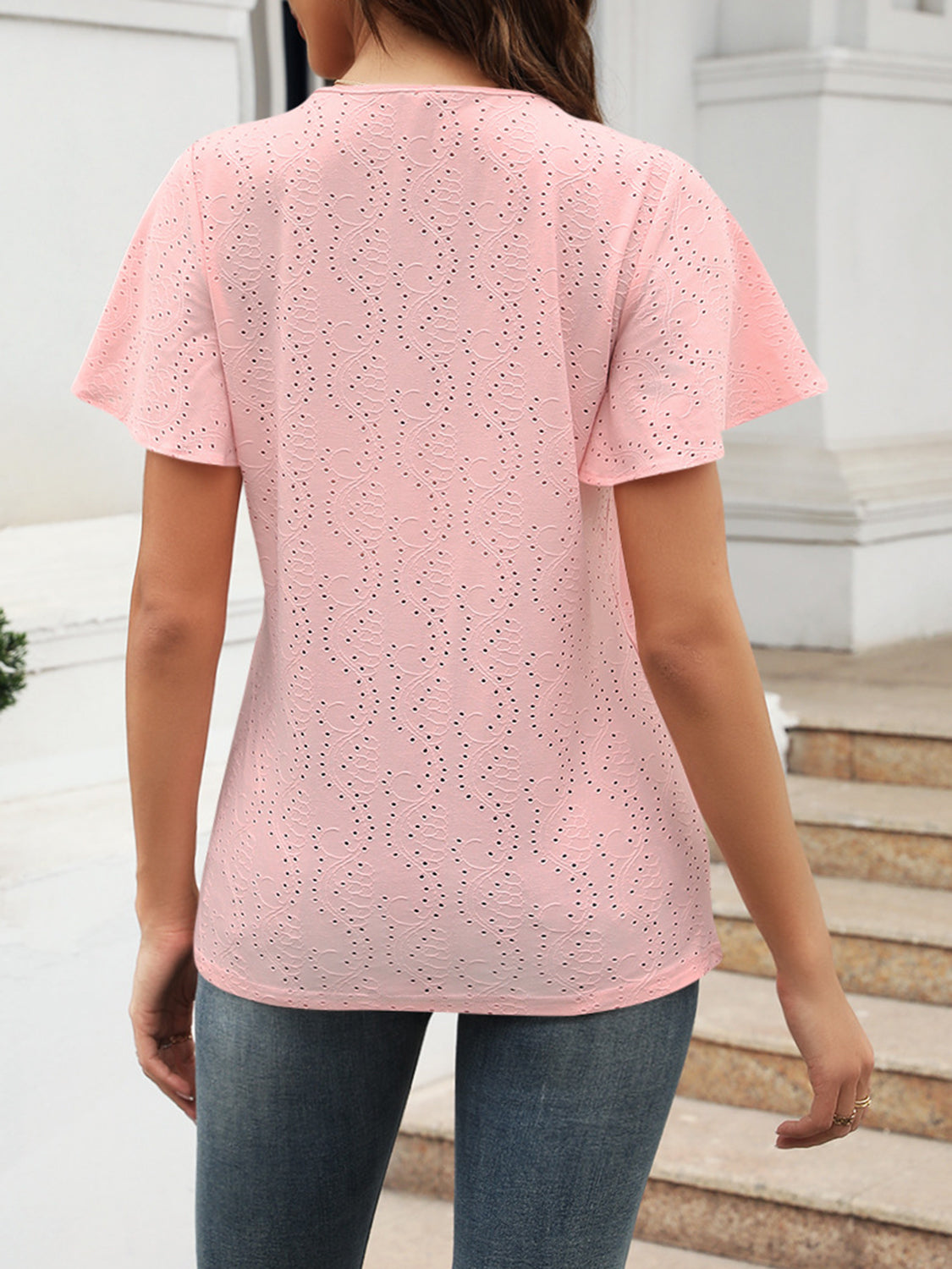 Eyelet V-neck short sleeve blouse.