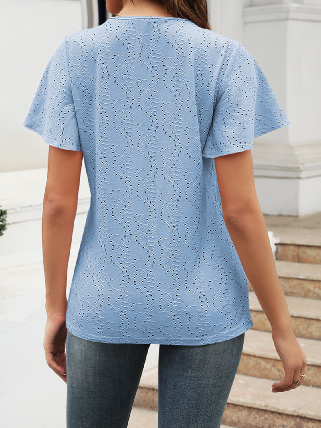 Eyelet V-neck short sleeve blouse.