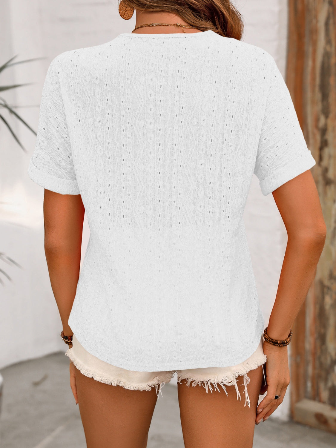 Ivy Lane eyelet V-neck short sleeve top.