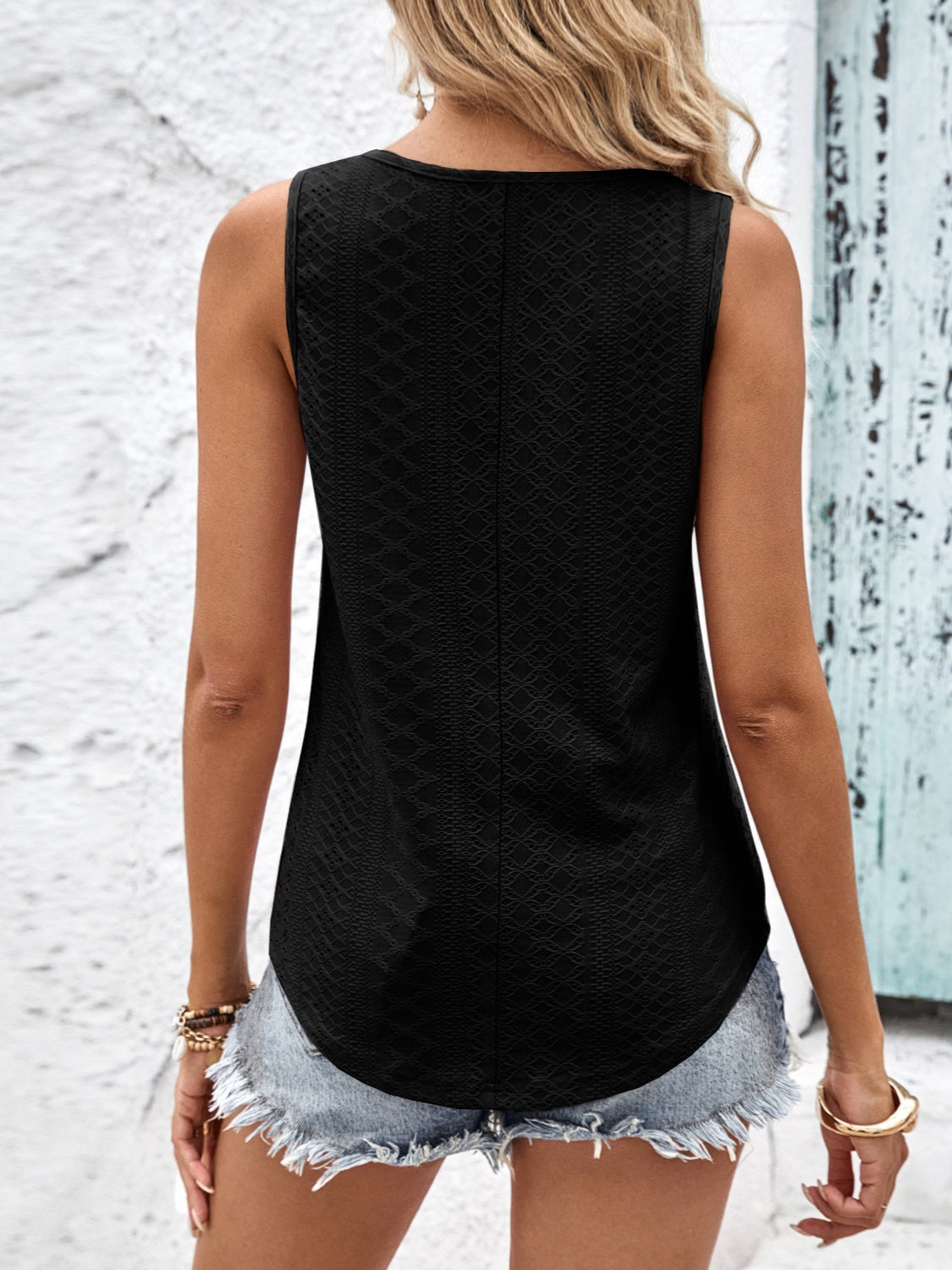 Eyelet wide strap tank top with crisscross back.