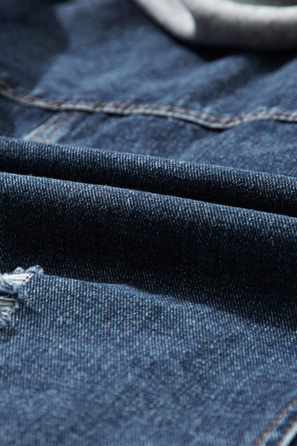 Distressed fake two-piece hooded zip-up denim jacket with buttoned pockets and drawstring.